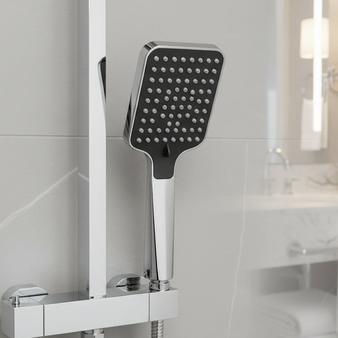 Handheld high-pressure shower head installed in modern bathroom