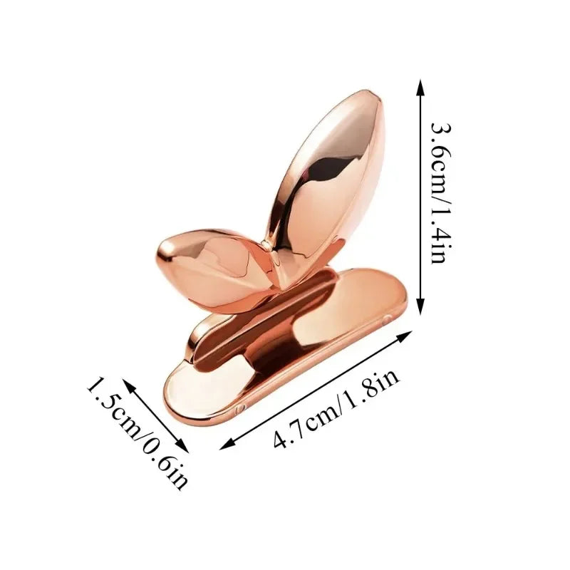 Rose gold toilet lid lifter with dimensions labeled on a white background