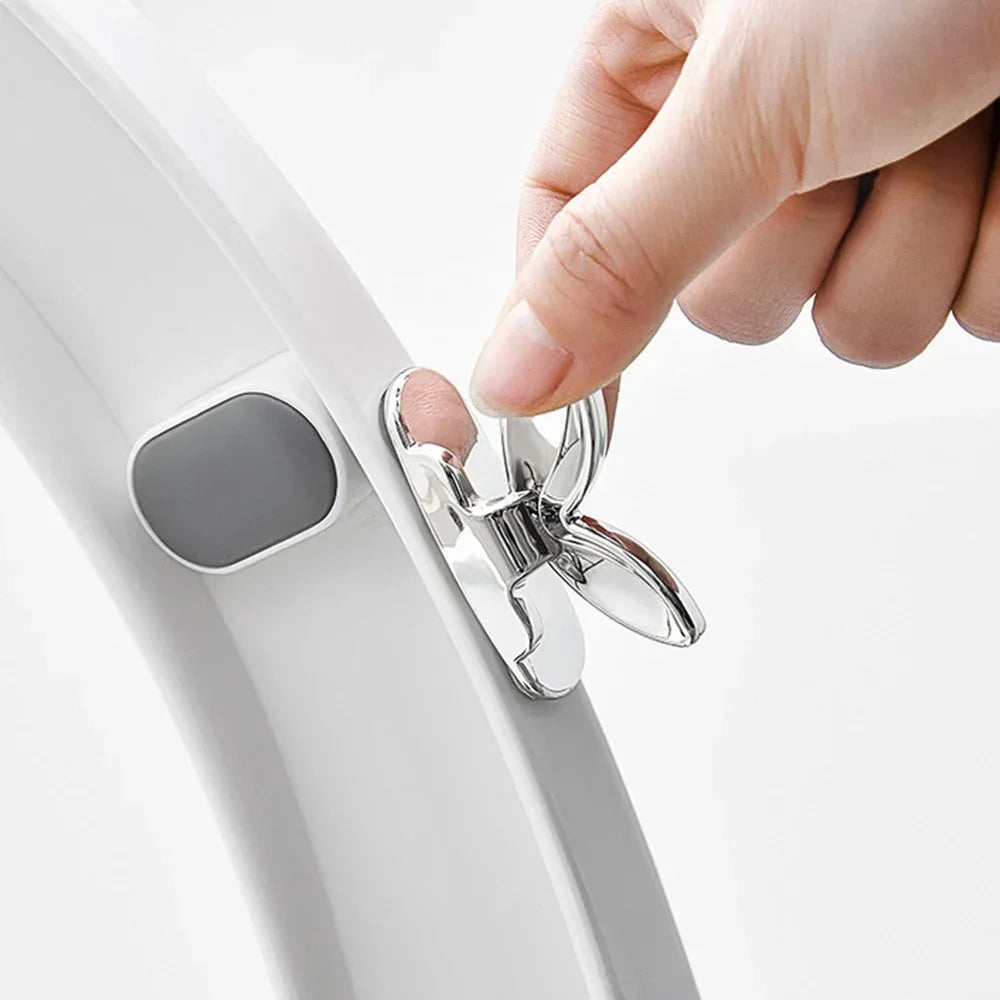 Hand lifting toilet seat using hygienic lid lifter handle