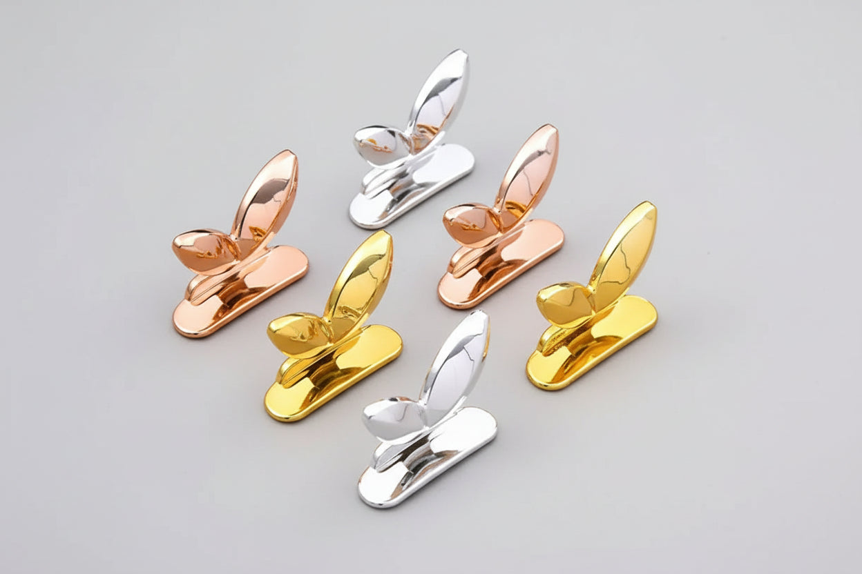 Set of toilet seat lid lifter handles in silver, gold and rose gold finishes