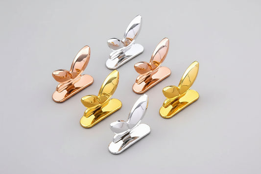 Set of toilet seat lid lifter handles in silver, gold and rose gold finishes