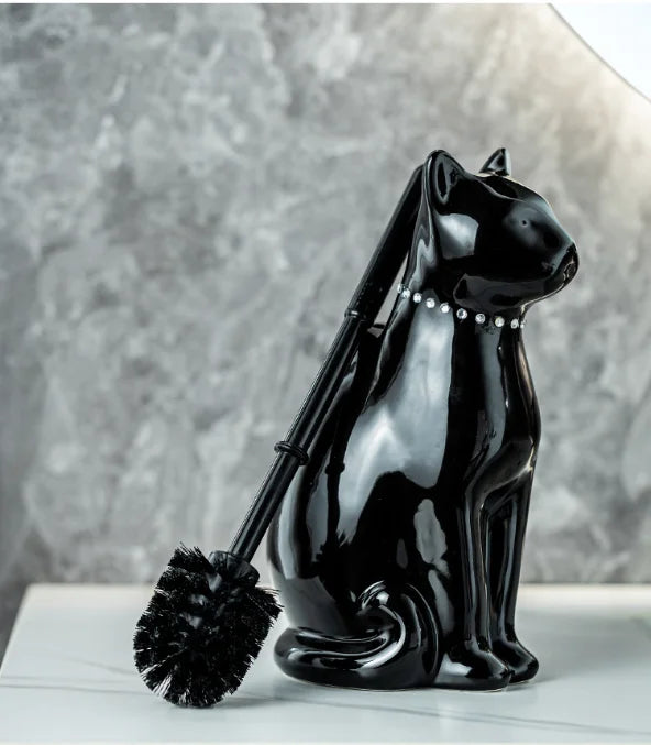Ceramic cat toilet brush with long handle removed from holder for cleaning
