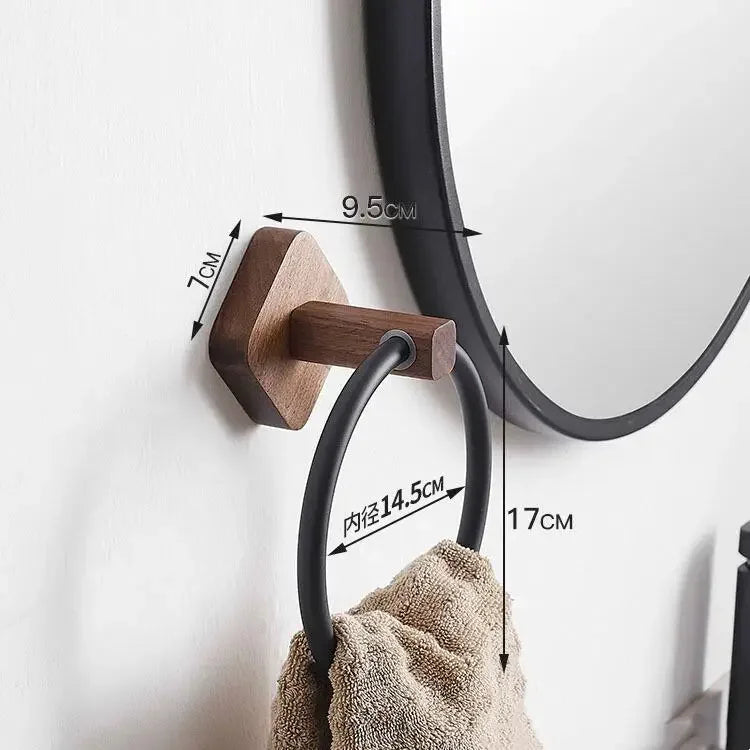 Walnut wood bathroom shelf with integrated towel rail holding toiletries and folded towel