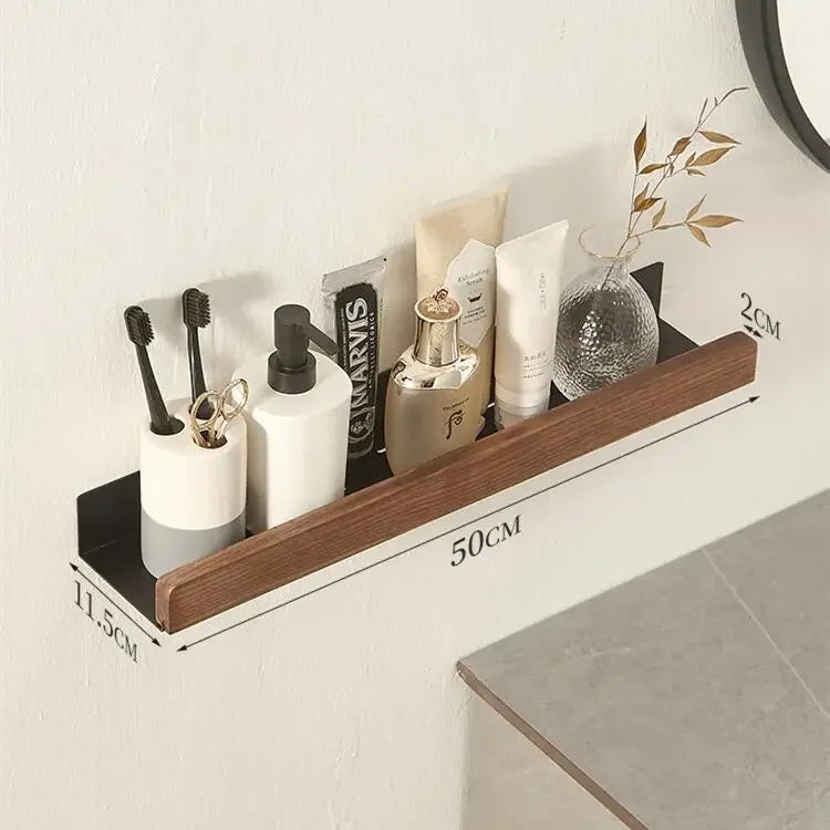 Walnut wood floating bathroom shelves with black metal frame holding toiletries